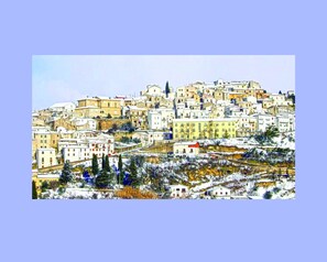A densely packed hillside town with buildings closely situated together.