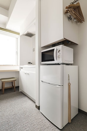 Mini-fridge, microwave, stovetop, cookware/dishes/utensils