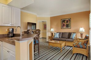 Enjoy a comfortable stay in this well-appointed room featuring a kitchenette, seating area, and dining table.