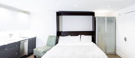 1 bedroom, desk, iron/ironing board, travel crib