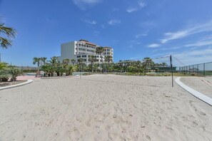On the beach, sun loungers, beach towels