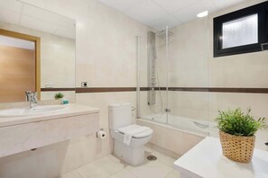 Bathtub, hair dryer, towels