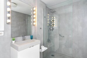 Shower, hair dryer, towels, toilet paper