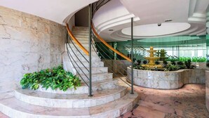 A marble staircase with a golden fountain at the top, surrounded by greenery. - Lovely seaview apartment by Costarentals - Ref 106 (Benalmádena)