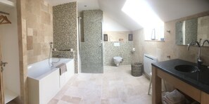 Bathtub, hair dryer, towels, soap