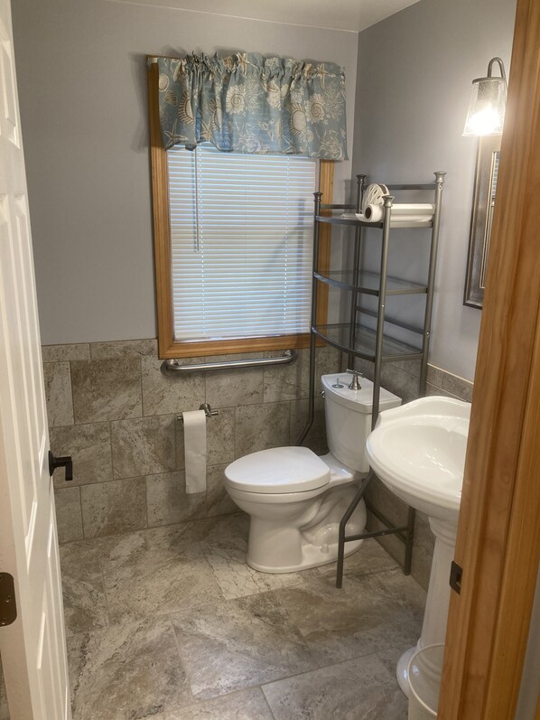 A bathroom with a toilet, sink, and a towel rack. - 1500 sqft private entrance with beautiful views of the Berkshire Mountains (Lee)