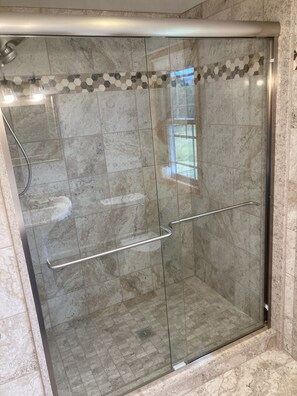 Shower, hair dryer, towels, soap