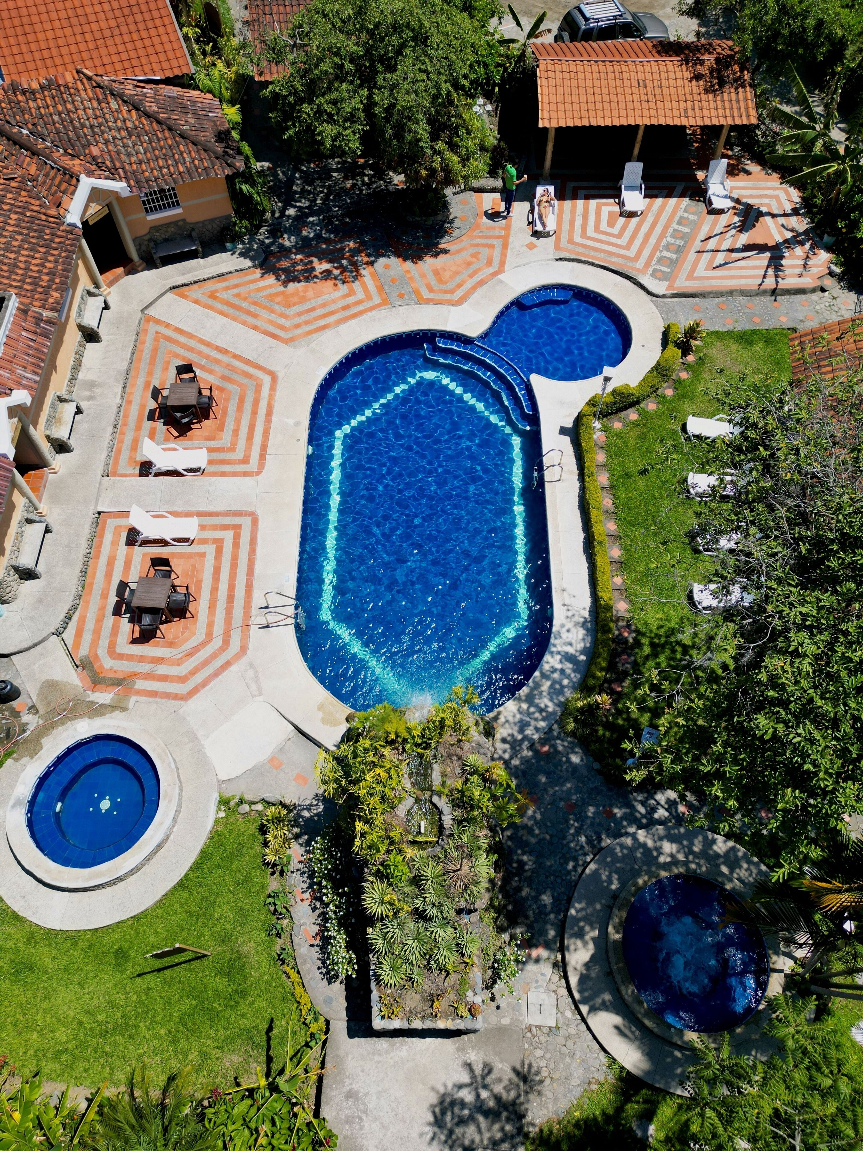 outdoor pool, open 11:00 am to 6:00 pm, pool umbrellas, pool loungers