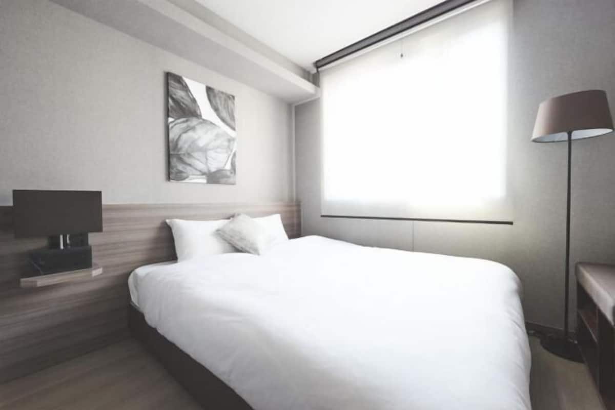 Desk, laptop workspace, blackout curtains, iron/ironing board