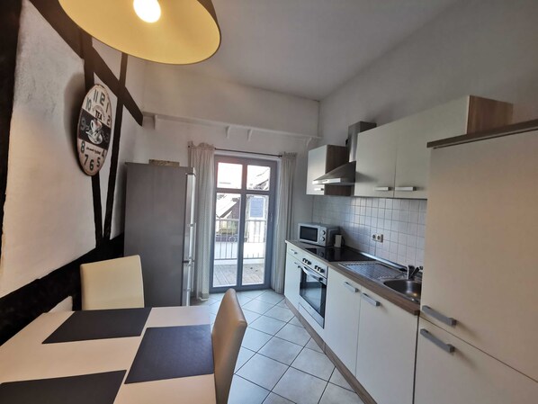 Fridge, oven, electric kettle, toaster