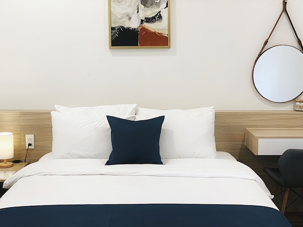Habitación doble económica de uso individual, para no fumadores | Minibar, caja de seguridad en la habitación y escritorio 