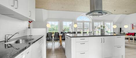Fridge, stovetop, dishwasher, coffee/tea maker
