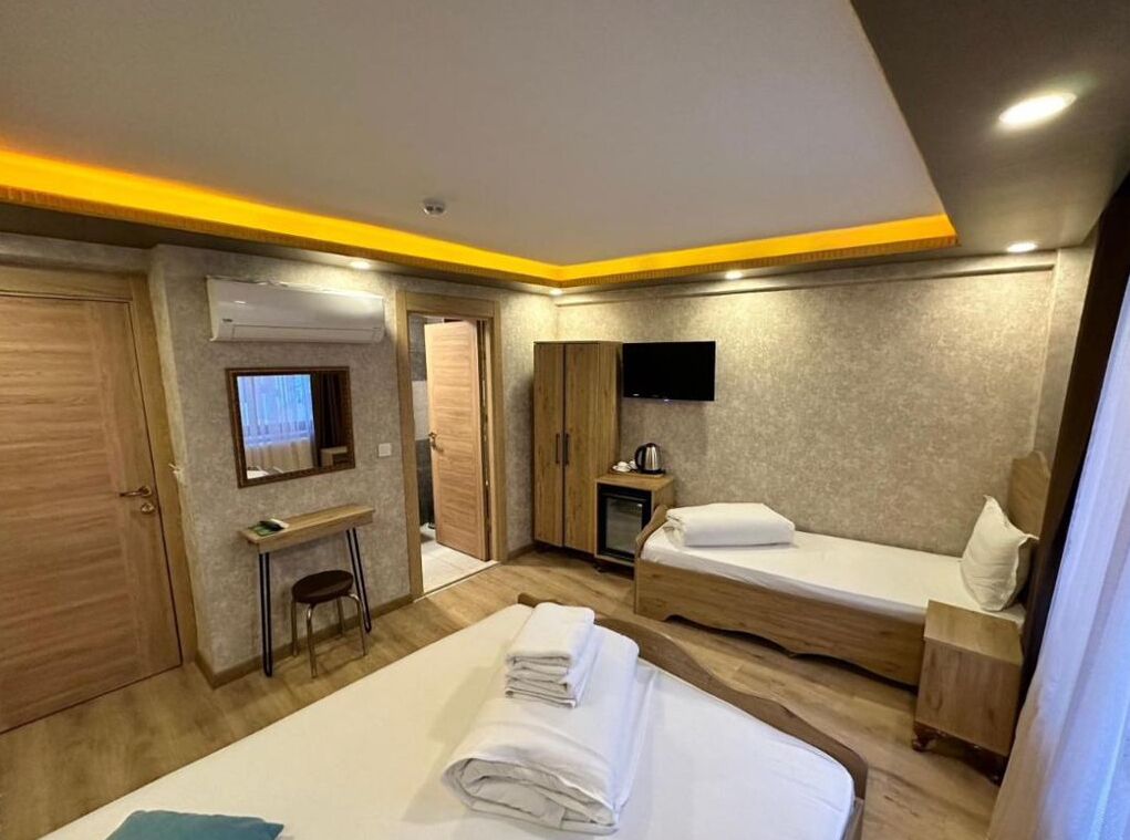 Lakens van Egyptisch katoen, luxe beddengoed, een minibar, een bureau