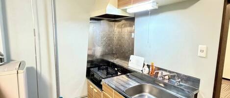 Fridge, microwave, stovetop, cookware/dishes/utensils