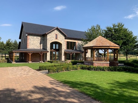 Outdoor wedding area. Burntwood Court Hotel