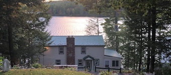 Spacious New Hampshire mountain waterfront get away house. Boats & private docks
