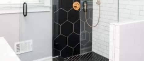 Combined shower/tub, hair dryer, towels, toilet paper