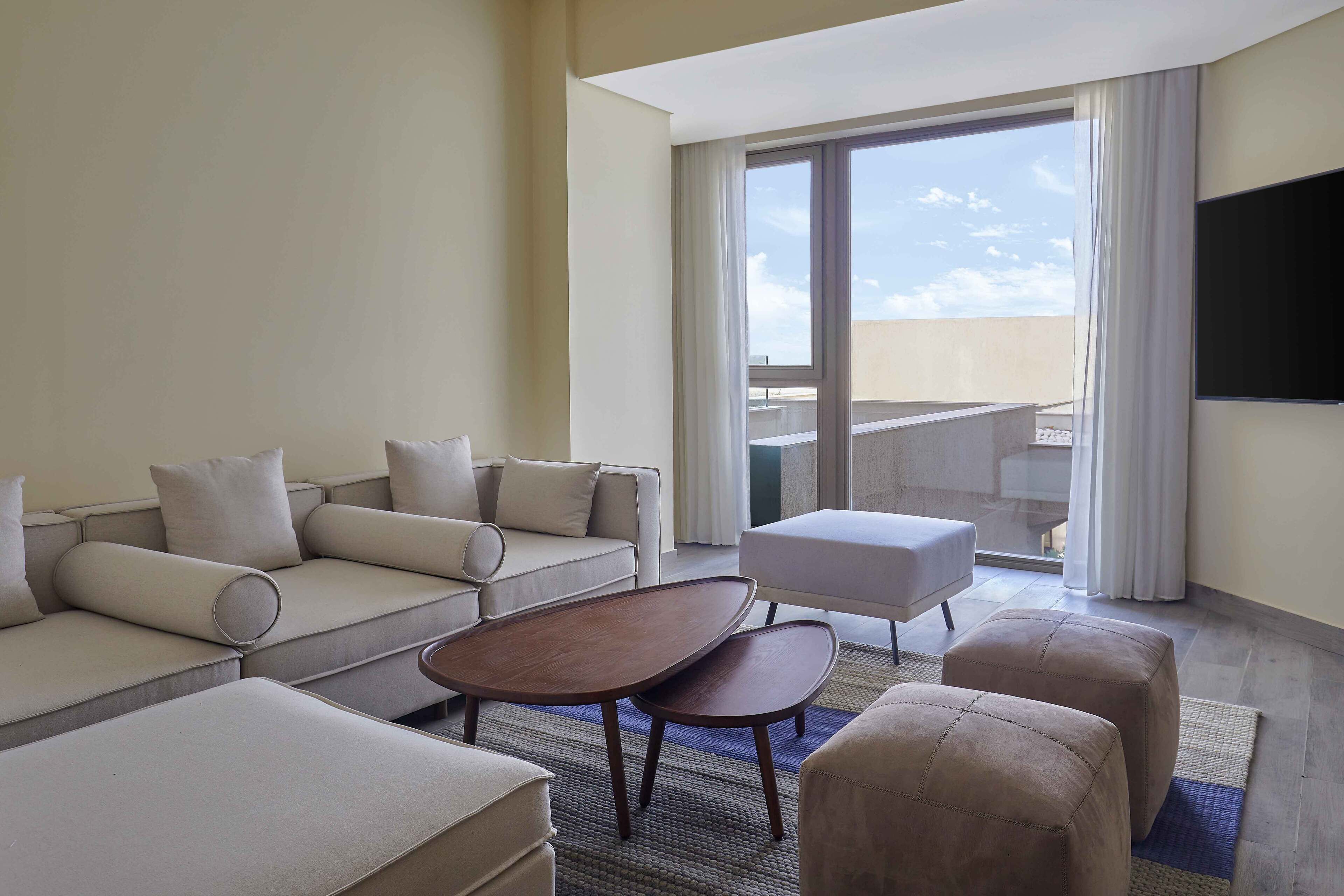 family room, garden view | living area | flat-screen tv