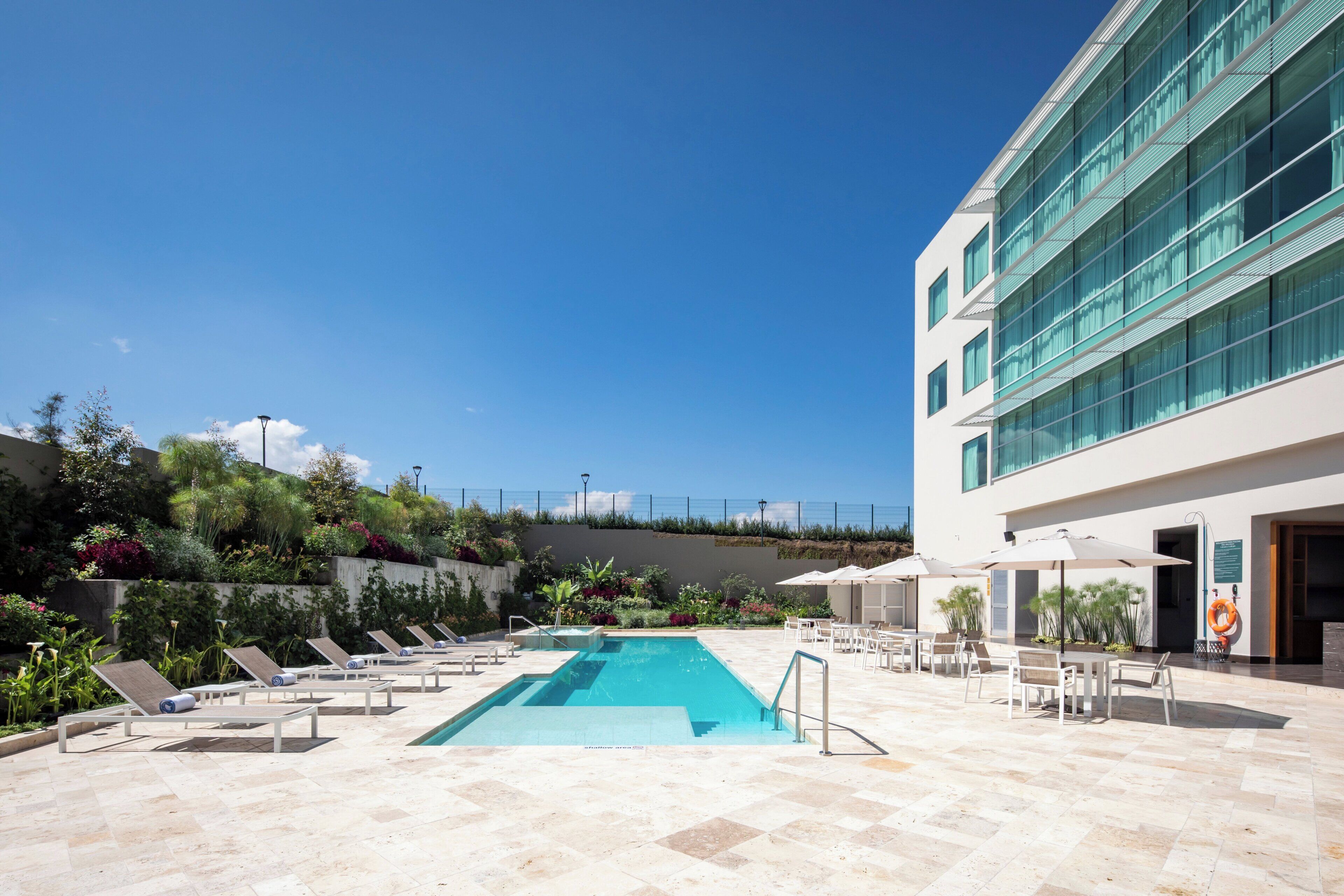 Outdoor pool, pool umbrellas, sun loungers