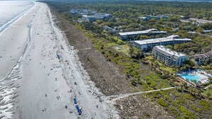 A coastal hotel with a beach view, multiple buildings, and a swimming pool area. - Direct Ocean Front First Floor 1BR/1Bath Condo (Hilton Head Island)