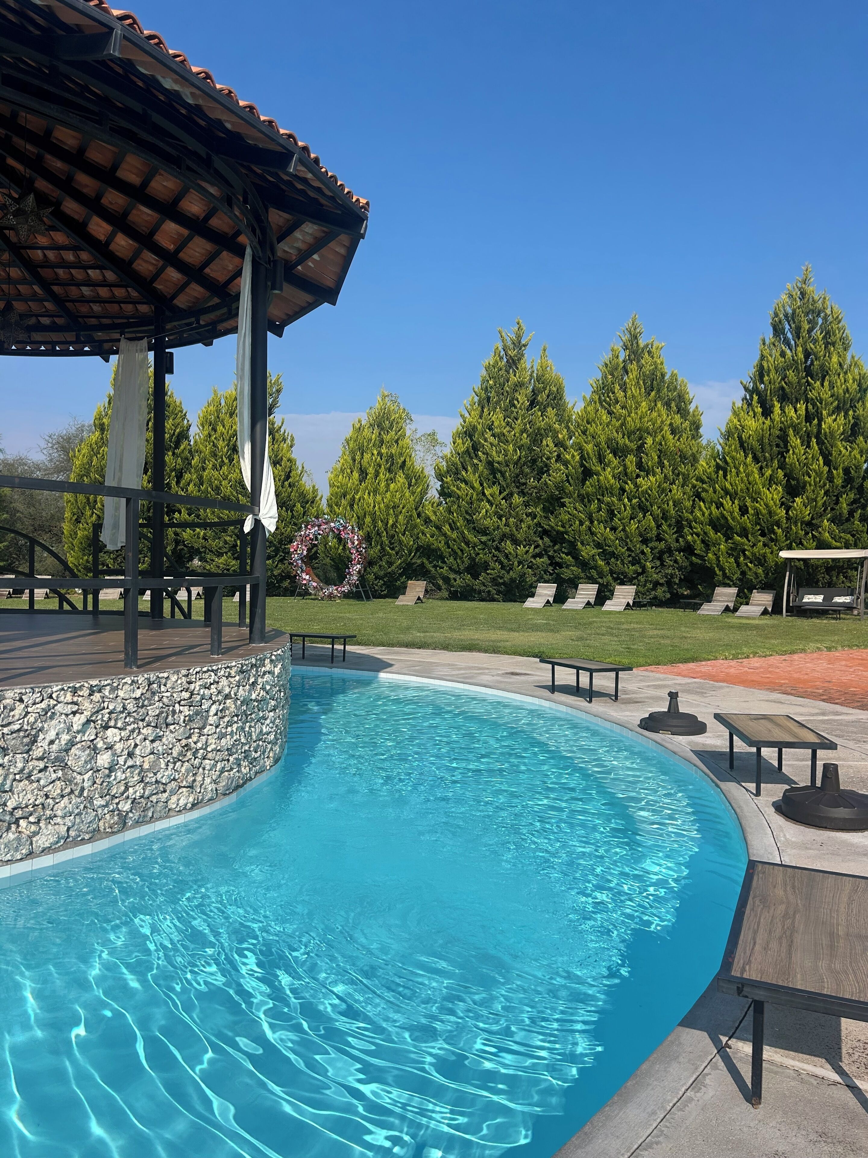 Outdoor pool, open 3:00 PM to 11:00 PM, pool loungers