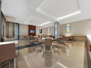 A modern hotel lobby with a spacious layout, multiple seating areas, and a large window providing natural light. - City Comfort Inn Guangzhou Tiyu West Road Metro Station (Guangzhou)