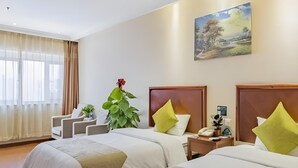 A hotel room with two beds, a large window with curtains, a painting on the wall, and a plant. - Greentree Inn Beijing Changping Shahe Metro Station Express Hotel (Changping)
