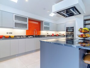 Oven, dishwasher, high chair, cookware/dishes/utensils
