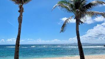 On the beach, sun loungers, beach towels
