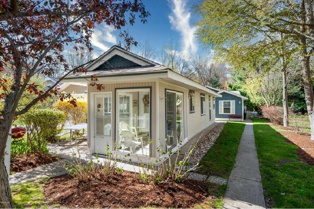 A perfect little cottage on a quiet cul-de-sac, one block from Lake Michigan. 