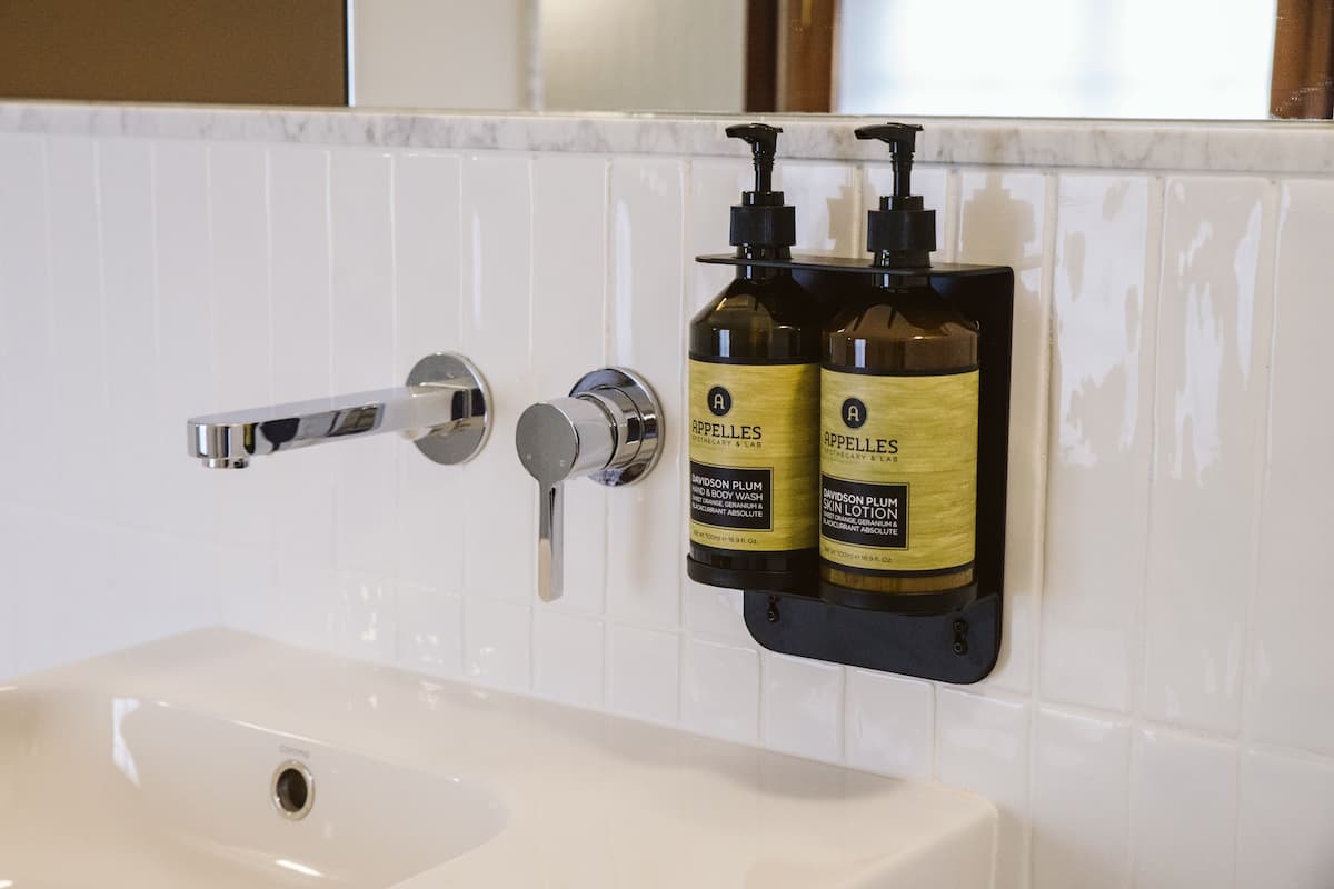 designer toiletries, hair dryer, bathrobes, towels