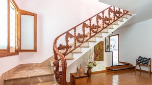 A grand staircase with ornate wood railings and a marble floor. - ESTREL - Wonderful chalet, with private pool and beautiful terraces, 280 meters fromthe be (Muro)