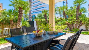 An outdoor dining area with a table, chairs, and a fruit bowl. - ESTREL - Wonderful chalet, with private pool and beautiful terraces, 280 meters fromthe be (Muro)
