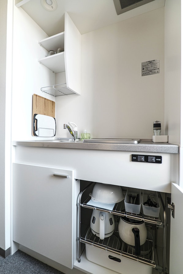 Mini-fridge, microwave, stovetop, cookware/dishes/utensils