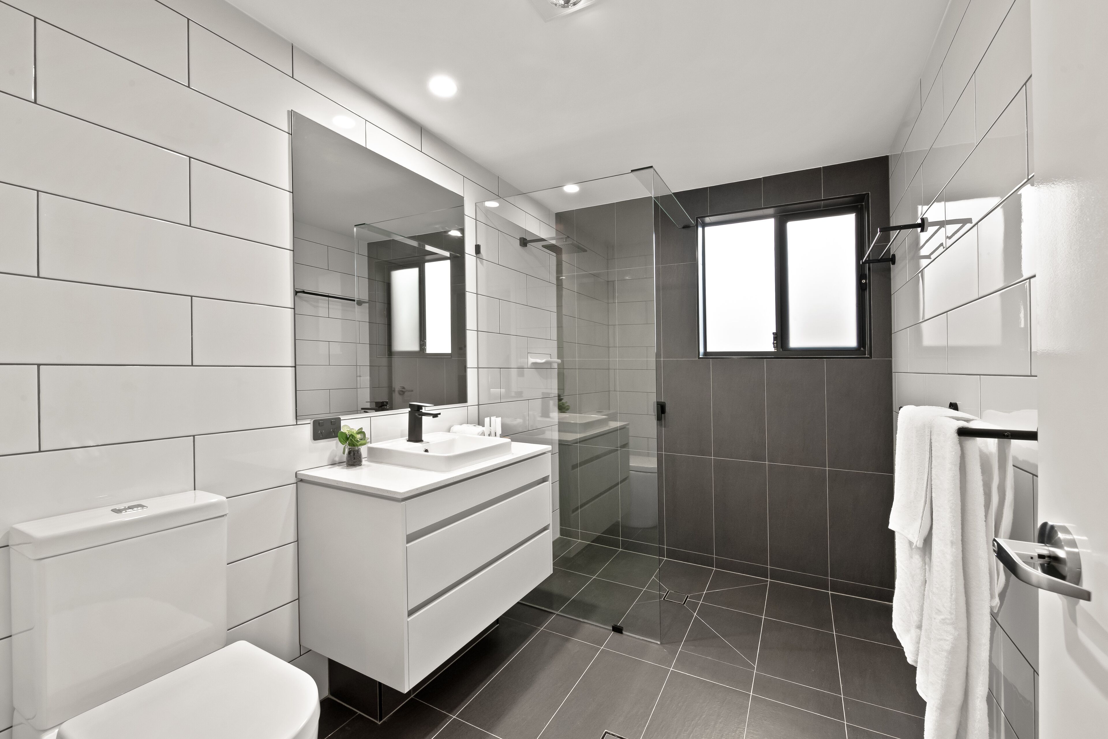 Shower, rainfall showerhead, towels
