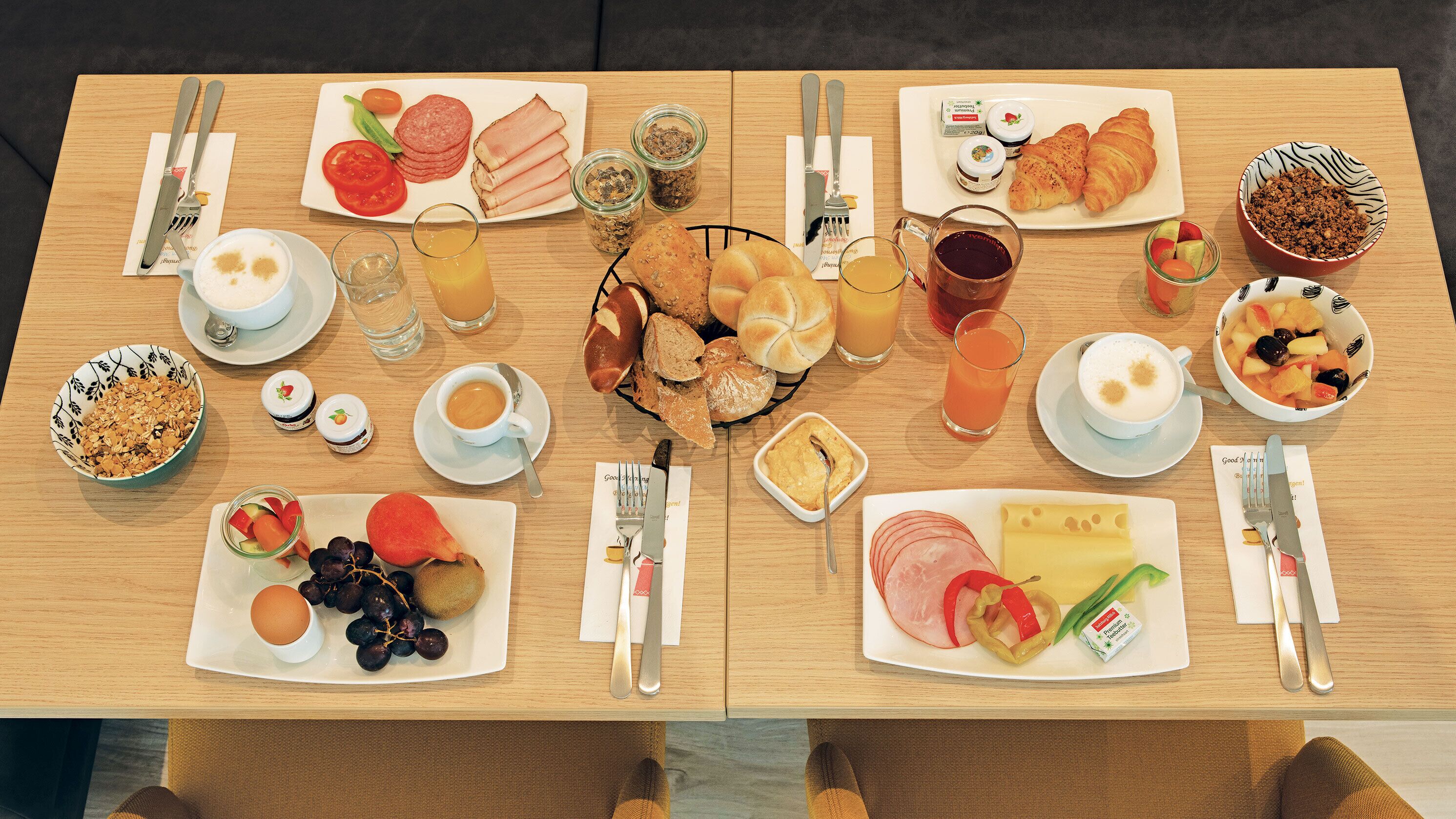 A breakfast buffet with various food items and beverages.