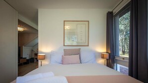 A neatly made bed with white linens and a pink blanket, a framed menu on the wall, and a window with curtains. - Marlu Station - Secluded family getaway in Broke (Broke)