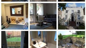 A living room with a television, bookshelves, and a coffee table. - 2-bed, Sleeps 4, Garden (London)