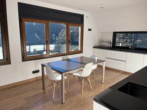Enjoy meals in the kitchen's dining area with a scenic view.