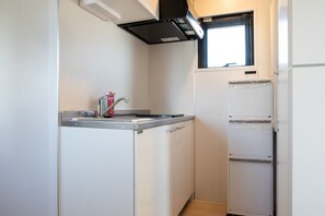 Fridge, microwave, stovetop, cookware/dishes/utensils