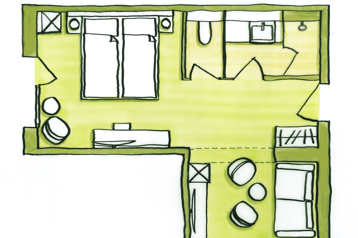 A floor plan with a kitchen, dining area, and two bedrooms.