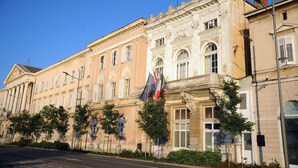 A historic building with classical architecture, featuring columns and ornate detailing.