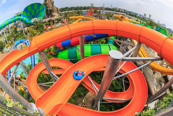 A water park with multiple water slides and a large hot air balloon. - Oyo 688 Bangkok Hub Hostel (Bangkok)