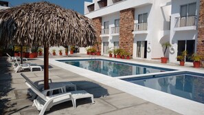 Outdoor pool, open 9:30 AM to 9:00 PM, pool loungers