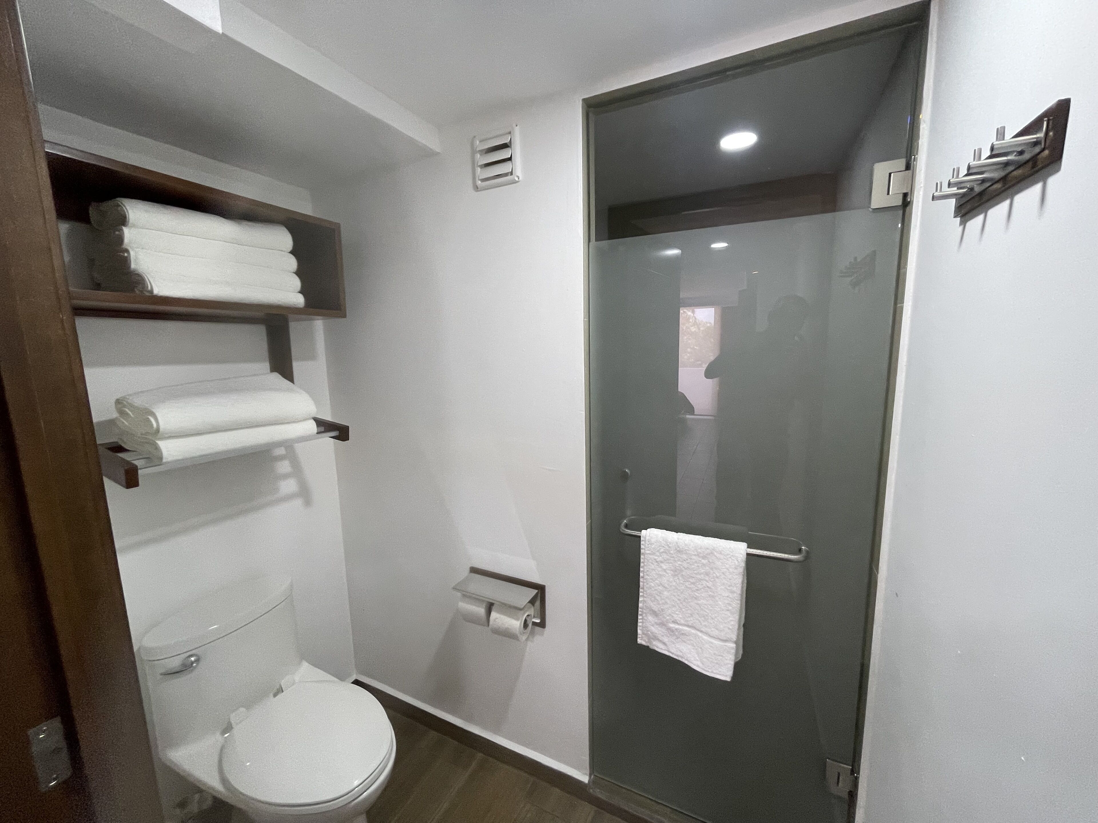 deluxe quadruple room | bathroom | shower, free toiletries, hair dryer, towels