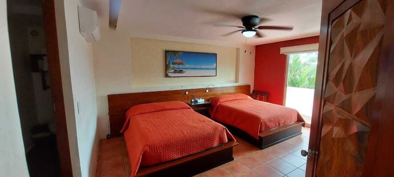 deluxe quadruple room | minibar, in-room safe, laptop workspace, free wifi