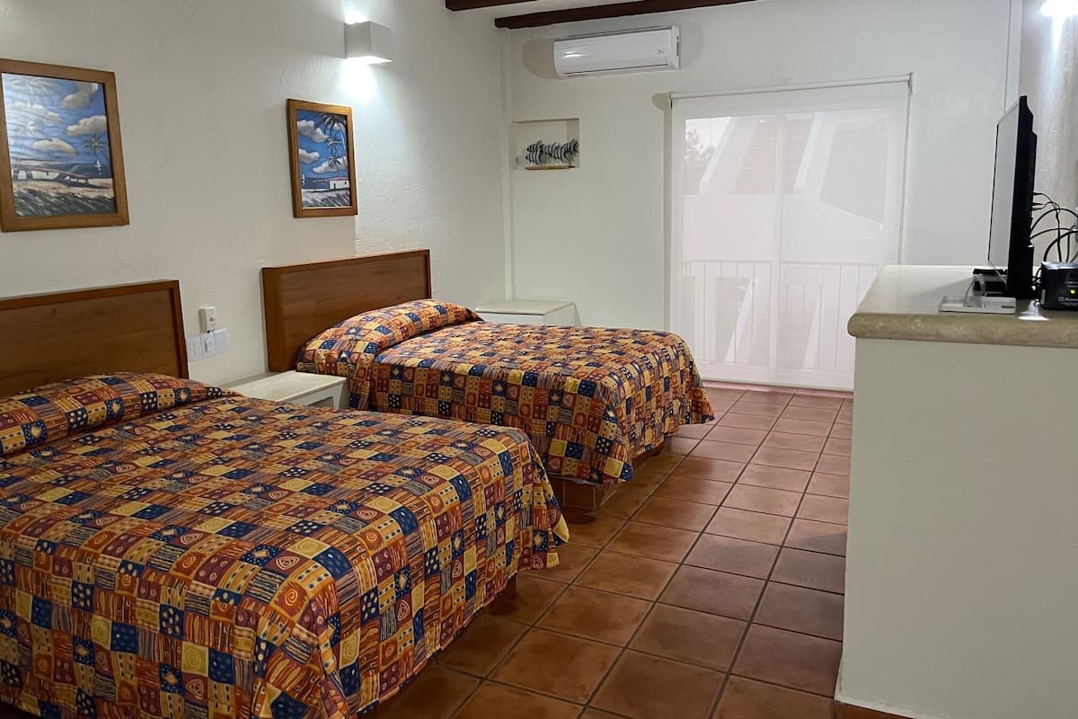 Traditional Quadruple Room | Minibar, in-room safe, laptop workspace, free WiFi