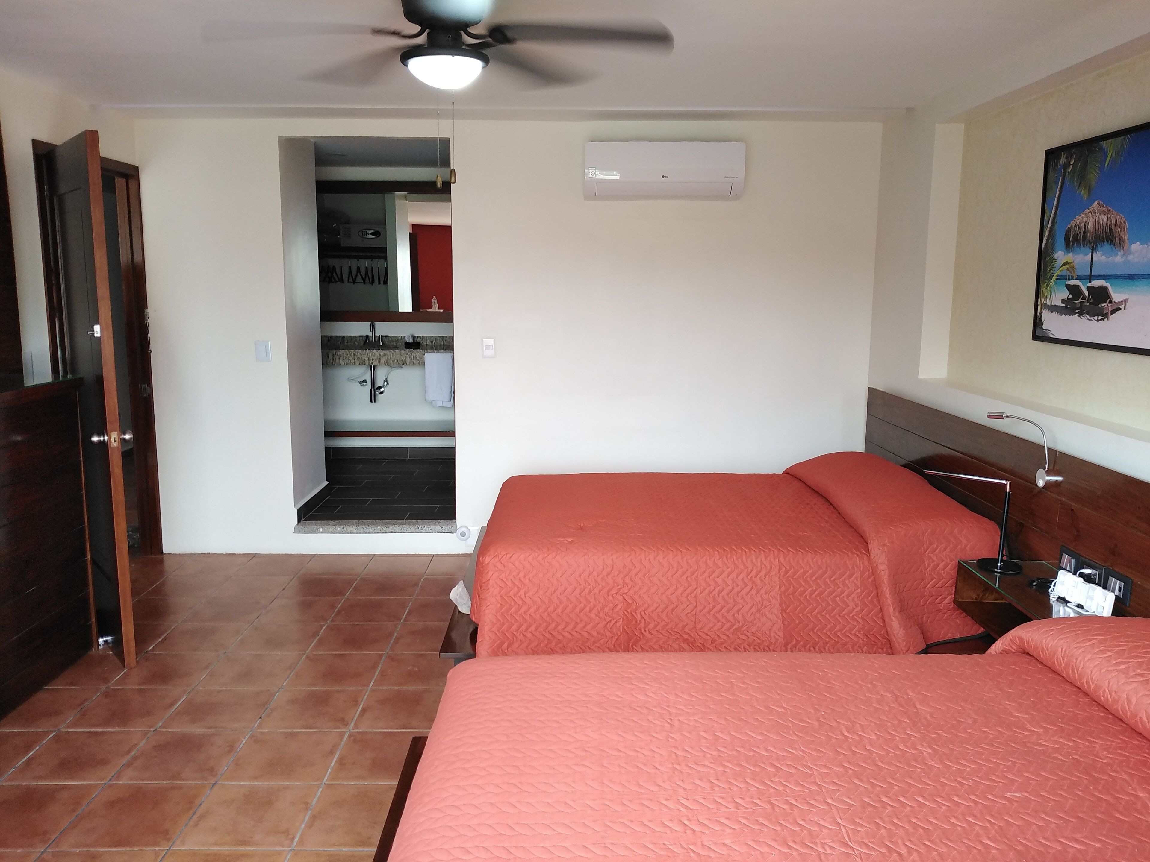 deluxe quadruple room | minibar, in-room safe, laptop workspace, free wifi