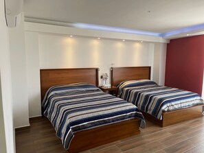 Deluxe Quadruple Room | Minibar, in-room safe, laptop workspace, free WiFi