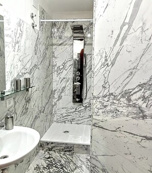 Shower, hair dryer, towels, soap